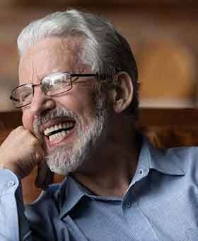 Man laughing with dentures