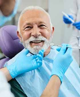 Man smiling in the dental chair