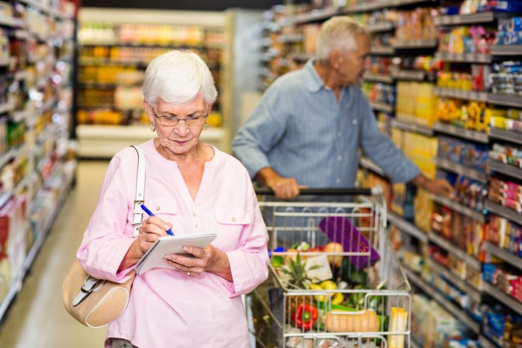 A man and woman grocery shopping.